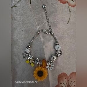 Silver Charm Bracelet with Floral Accents